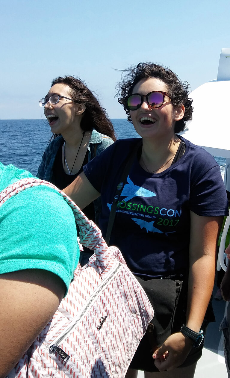 Two cousins whalewatching on a boat